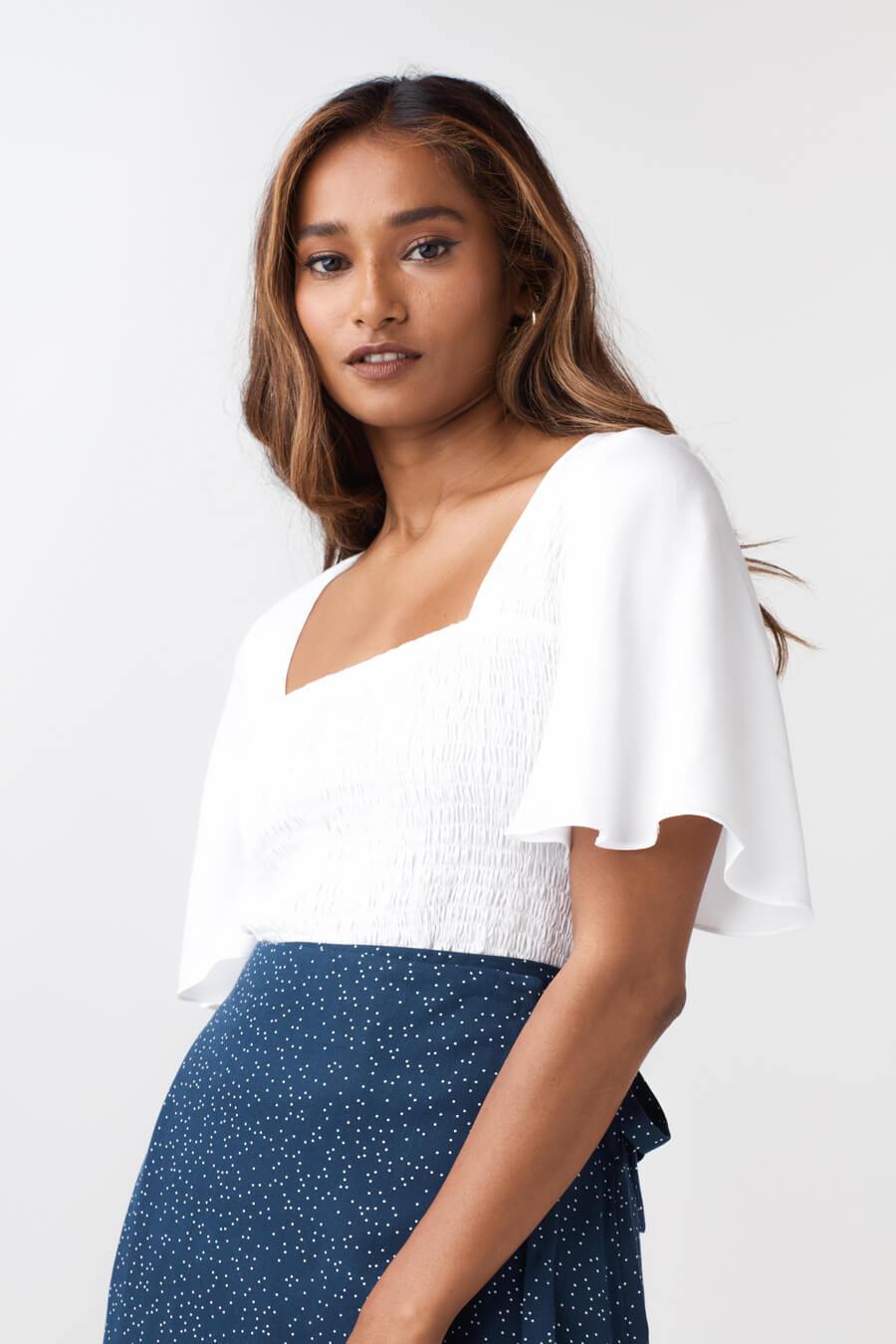 The Smocked Flutter Sleeve Blouse